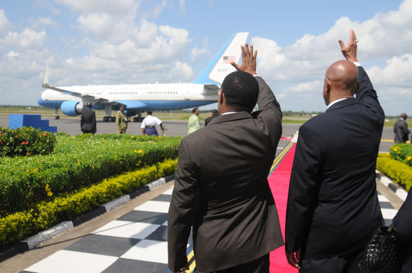 Ambassador Lenhardt and Tanzanian Foreign Affairs Minister Membe Wave Goodbye To Secretary Clinton